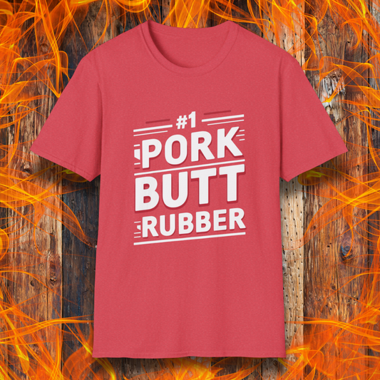 Heather Red T-shirt featuring a bold, humorous BBQ-themed design that reads '#1 PORK BUTT RUBBER' in red and white block lettering with stylish line accents. A fun shirt for grill masters and barbecue enthusiasts.
