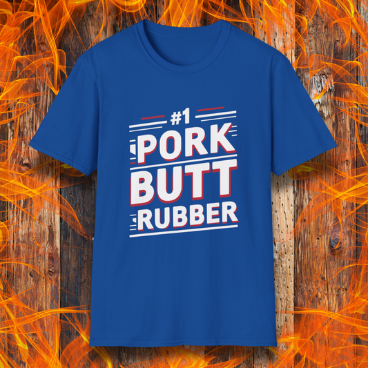 Royal Blue T-shirt featuring a bold, humorous BBQ-themed design that reads '#1 PORK BUTT RUBBER' in red and white block lettering with stylish line accents. A fun shirt for grill masters and barbecue enthusiasts.