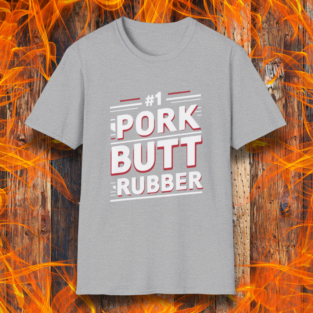 Sport Grey T-shirt featuring a bold, humorous BBQ-themed design that reads '#1 PORK BUTT RUBBER' in red and white block lettering with stylish line accents. A fun shirt for grill masters and barbecue enthusiasts.
