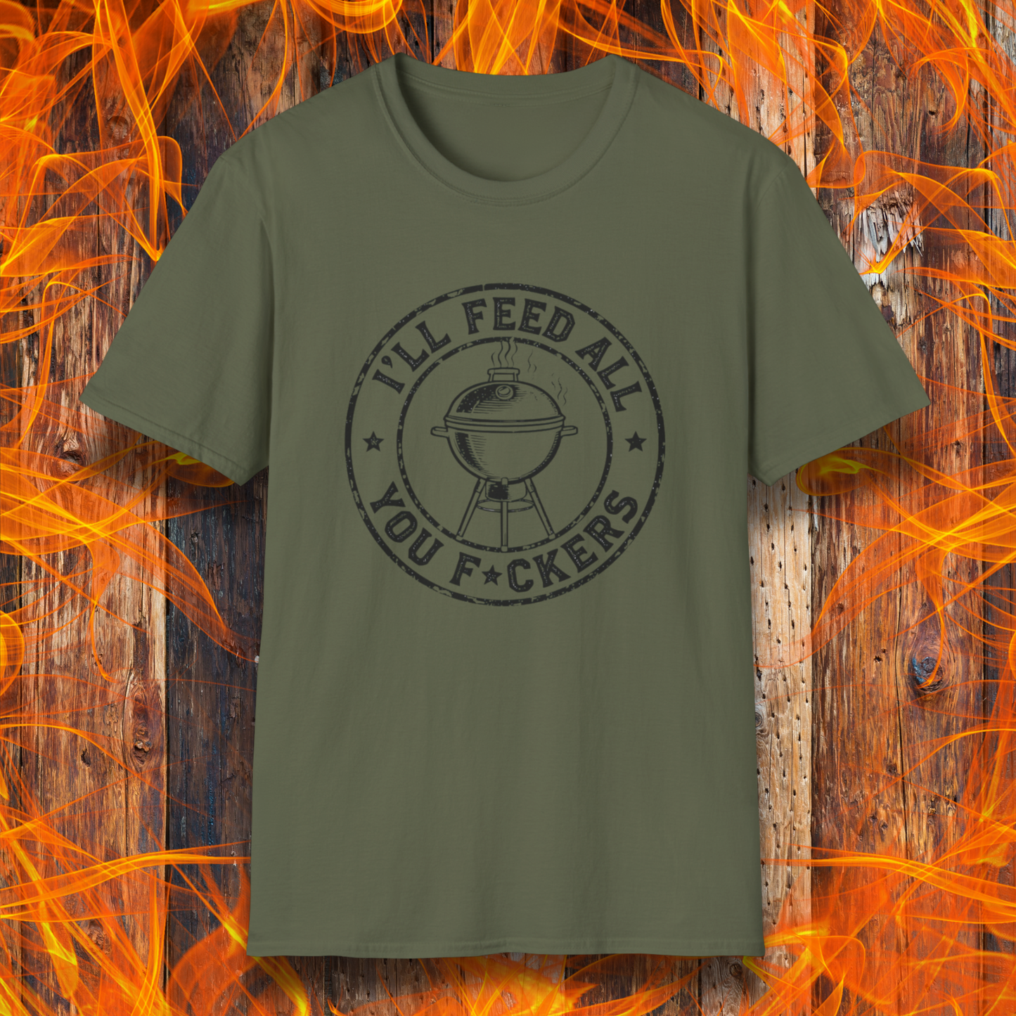 Green t-shirt with graphic design on a wooden background with flames