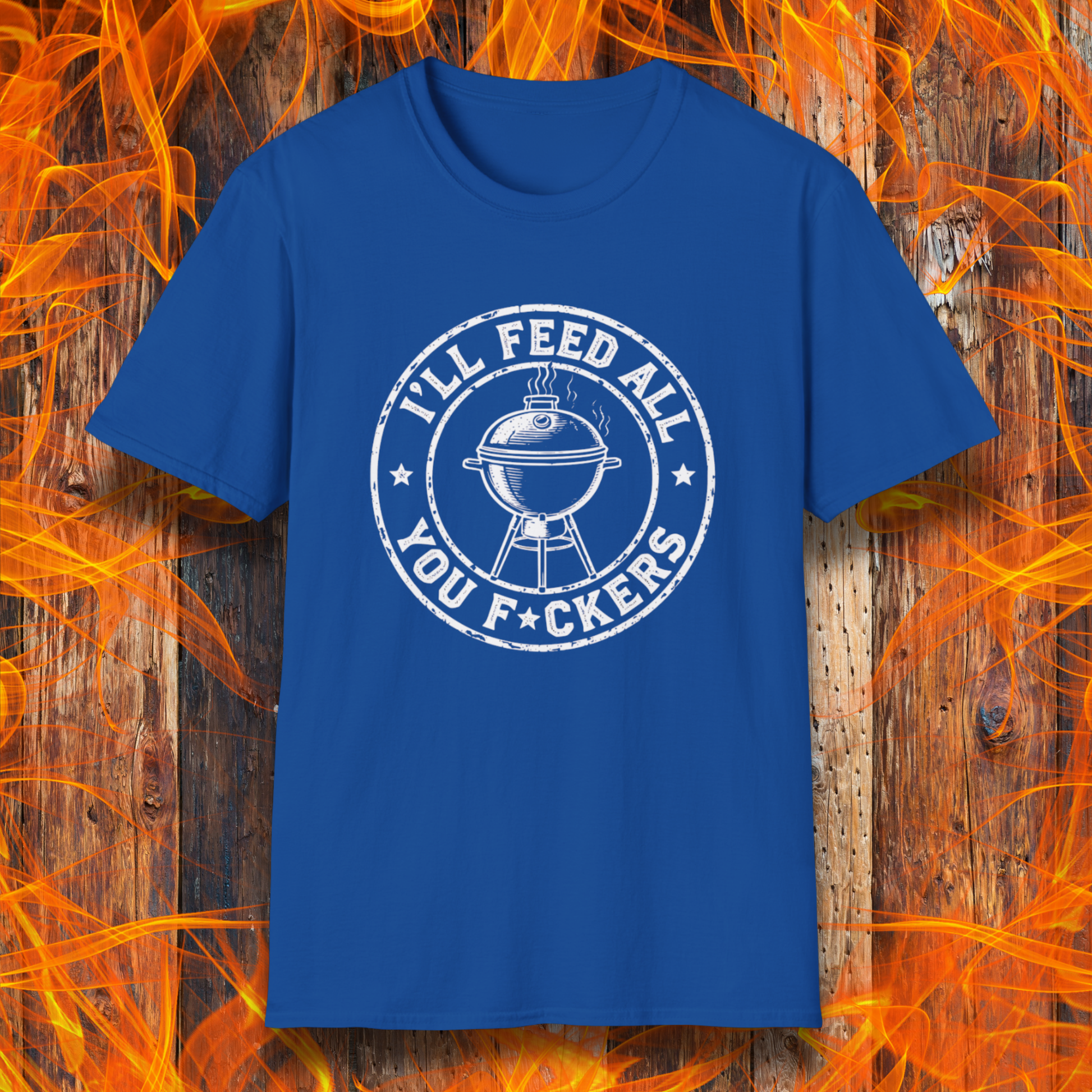 Blue t-shirt with graphic design on a wooden background with flames