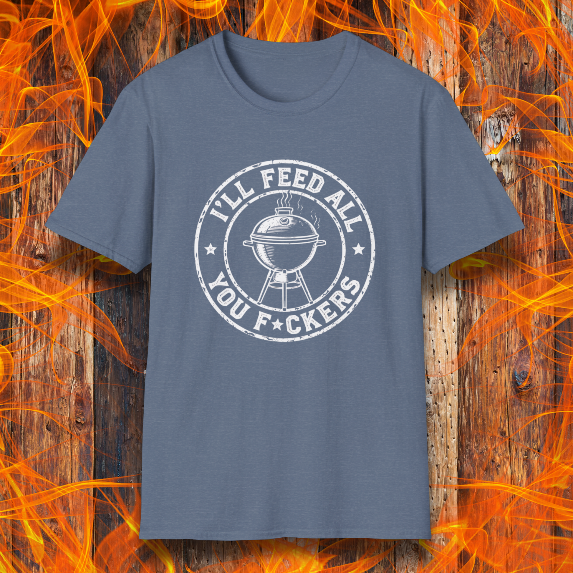 Blue t-shirt with graphic design on a wooden background with flames