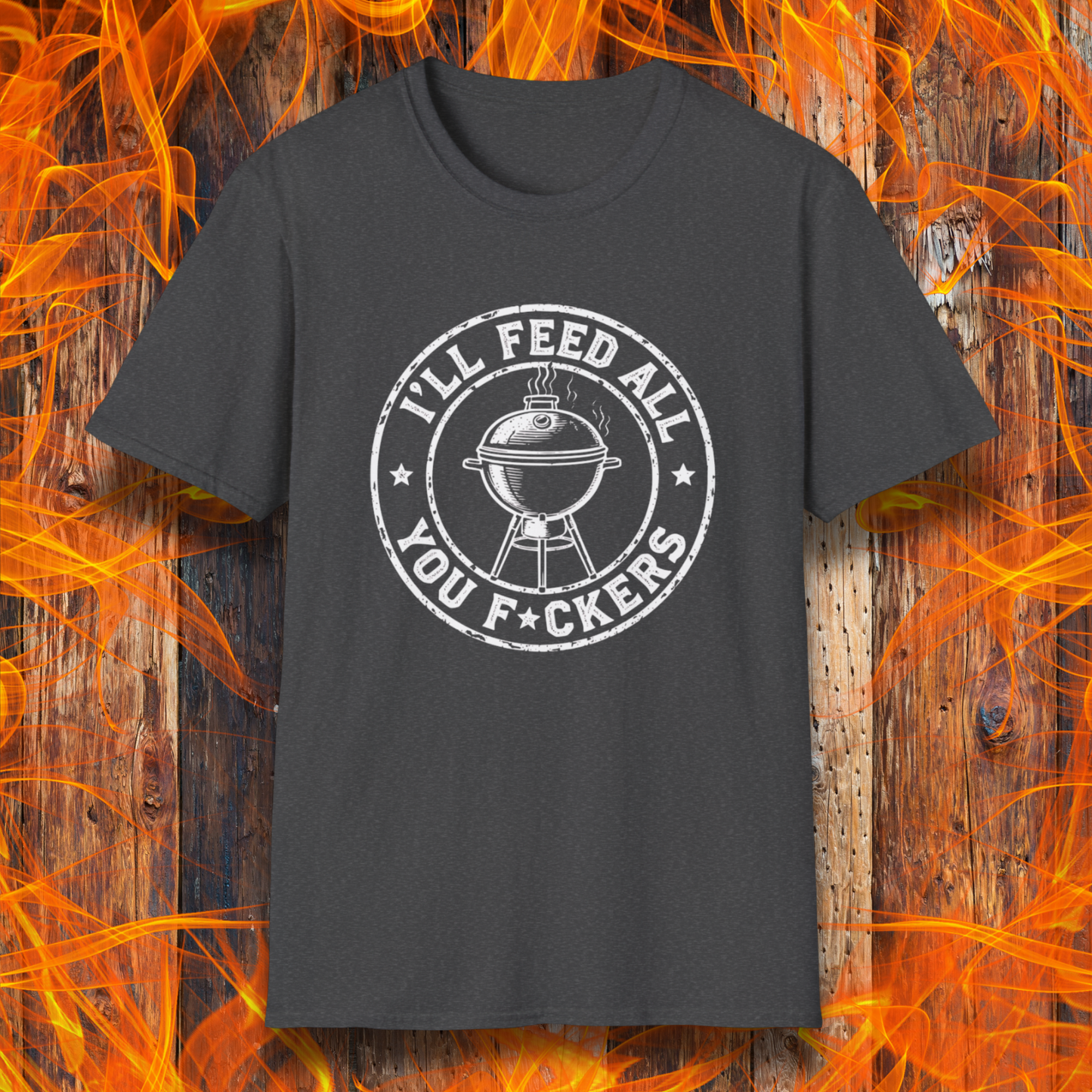 Black t-shirt with graphic design on a wooden background with flames