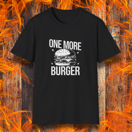 Black t-shirt with 'One More Burger' graphic on a wooden background with flames.