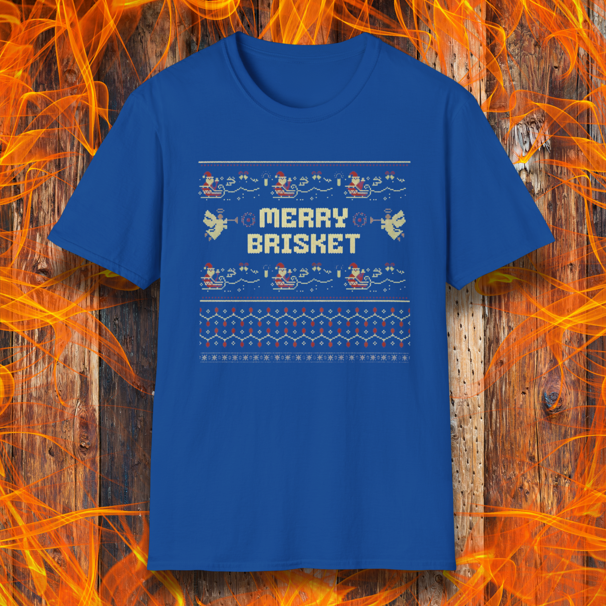 Blue t-shirt with 'Merry Brisket' text on a wooden background with flames.