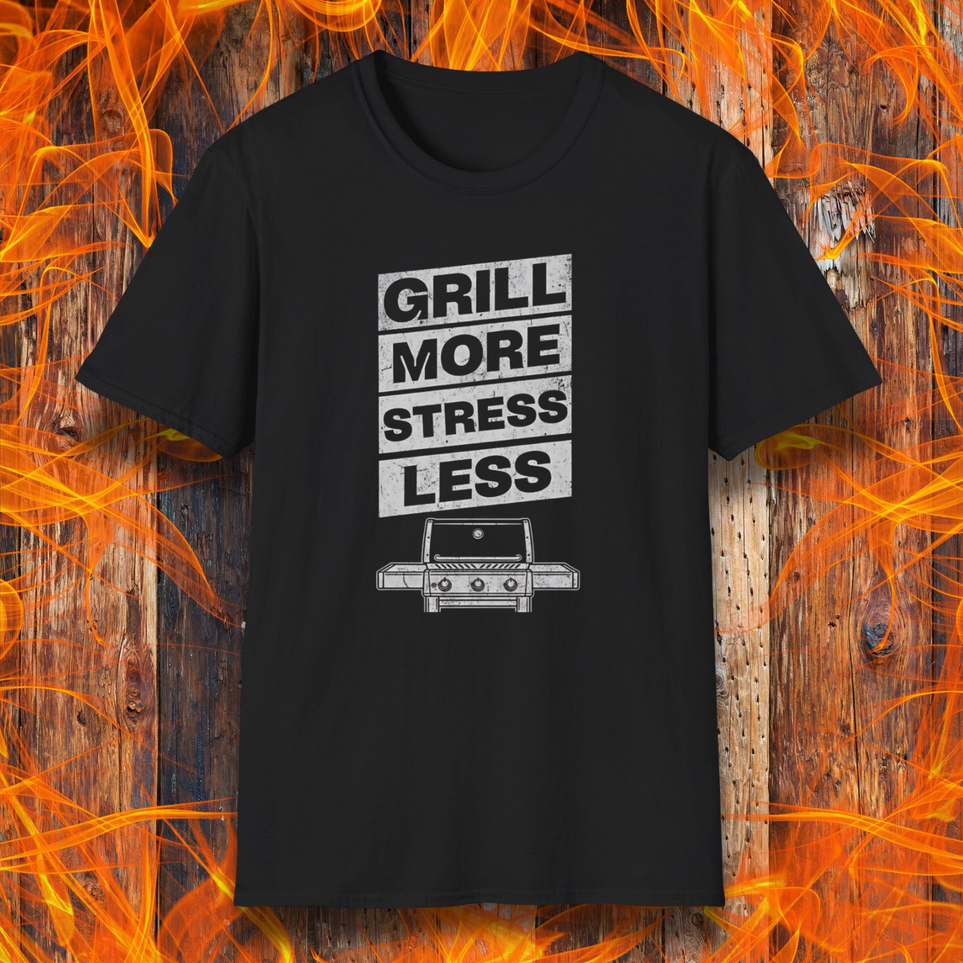 Black t-shirt with 'Grill More Stress Less' text and grill graphic on a fiery background