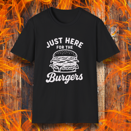 Black t-shirt with 'Just Here for the Burgers' text and graphic on a wooden background with flames.