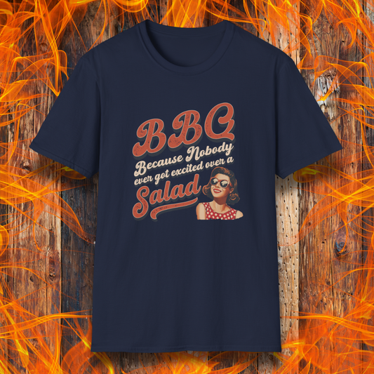 Navy blue t-shirt with a graphic and text on a wooden background with flames.
