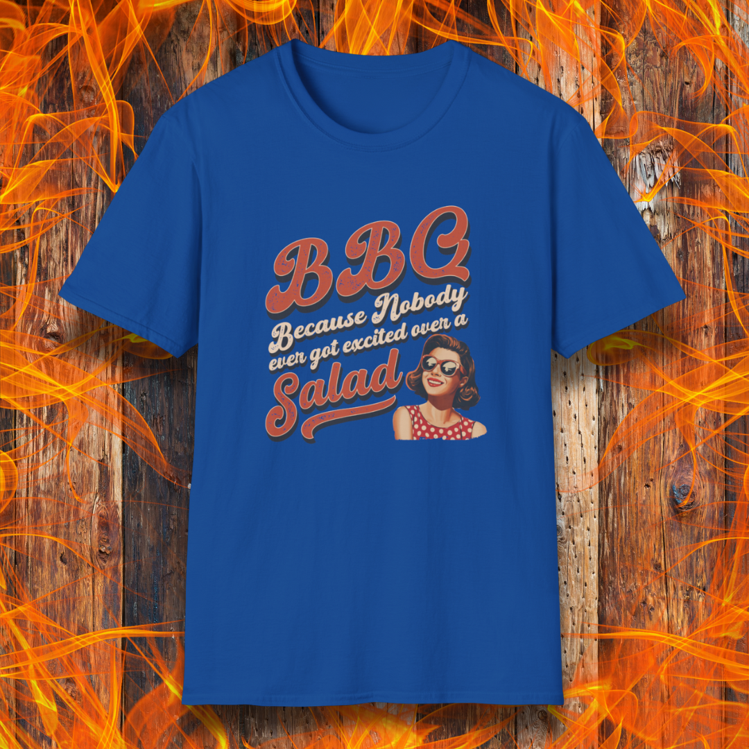 Blue t-shirt with graphic design and text on a wooden background with flames