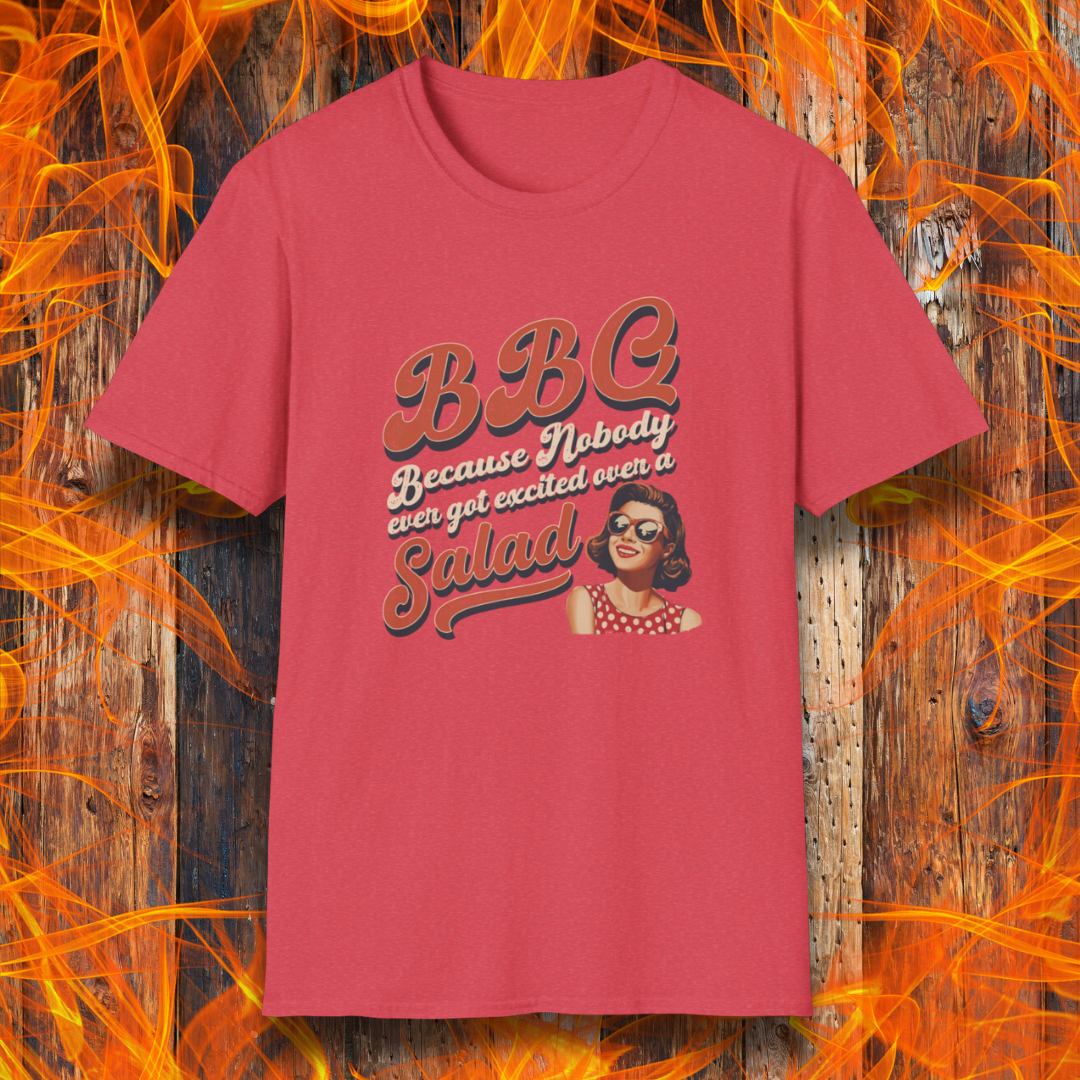 Red t-shirt with graphic design and text on a wooden background with flames.