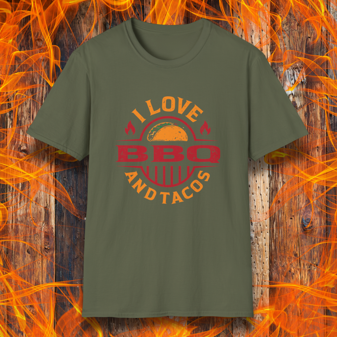 Green t-shirt with 'I Love BBQ and Tacos' design on a wooden background with flames.