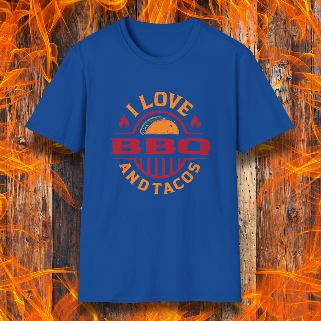 Blue t-shirt with 'I Love BBQ and Tacos' design on a wooden background with flames.