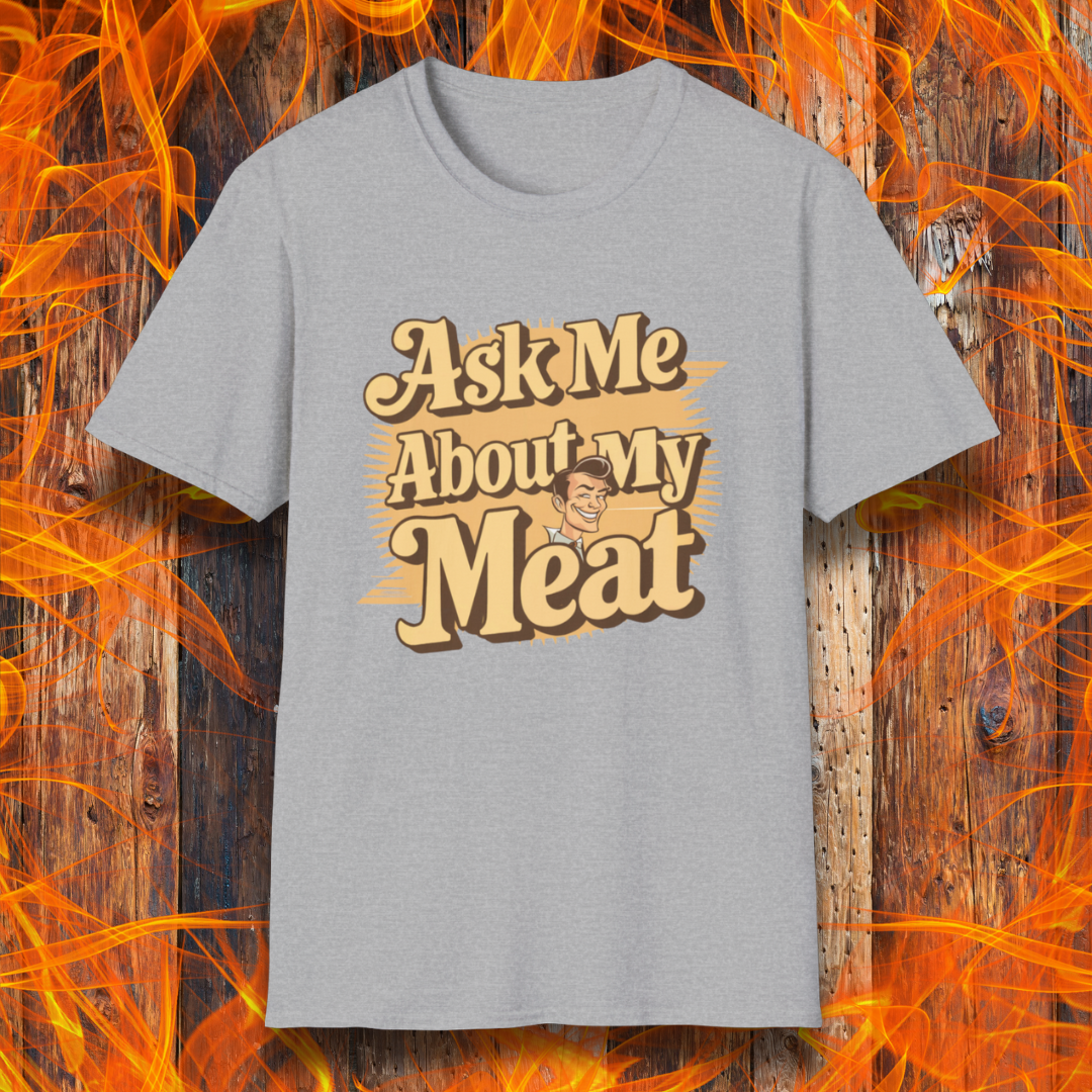Sport Grey T-shirt featuring a retro-style design with the phrase 'Ask Me About My Meat' in bold, vintage lettering. The text is accented with a smiling, cartoon-style character, giving it a humorous and playful BBQ-themed vibe.