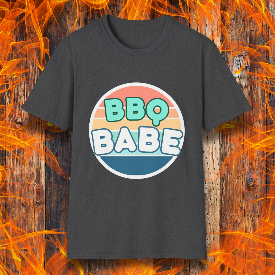 Dark Heather T-shirt with a retro-style 'BBQ Babe' design featuring bold, pastel lettering inside a vintage sunset circle. A fun and stylish choice for BBQ enthusiasts who love to grill in style.