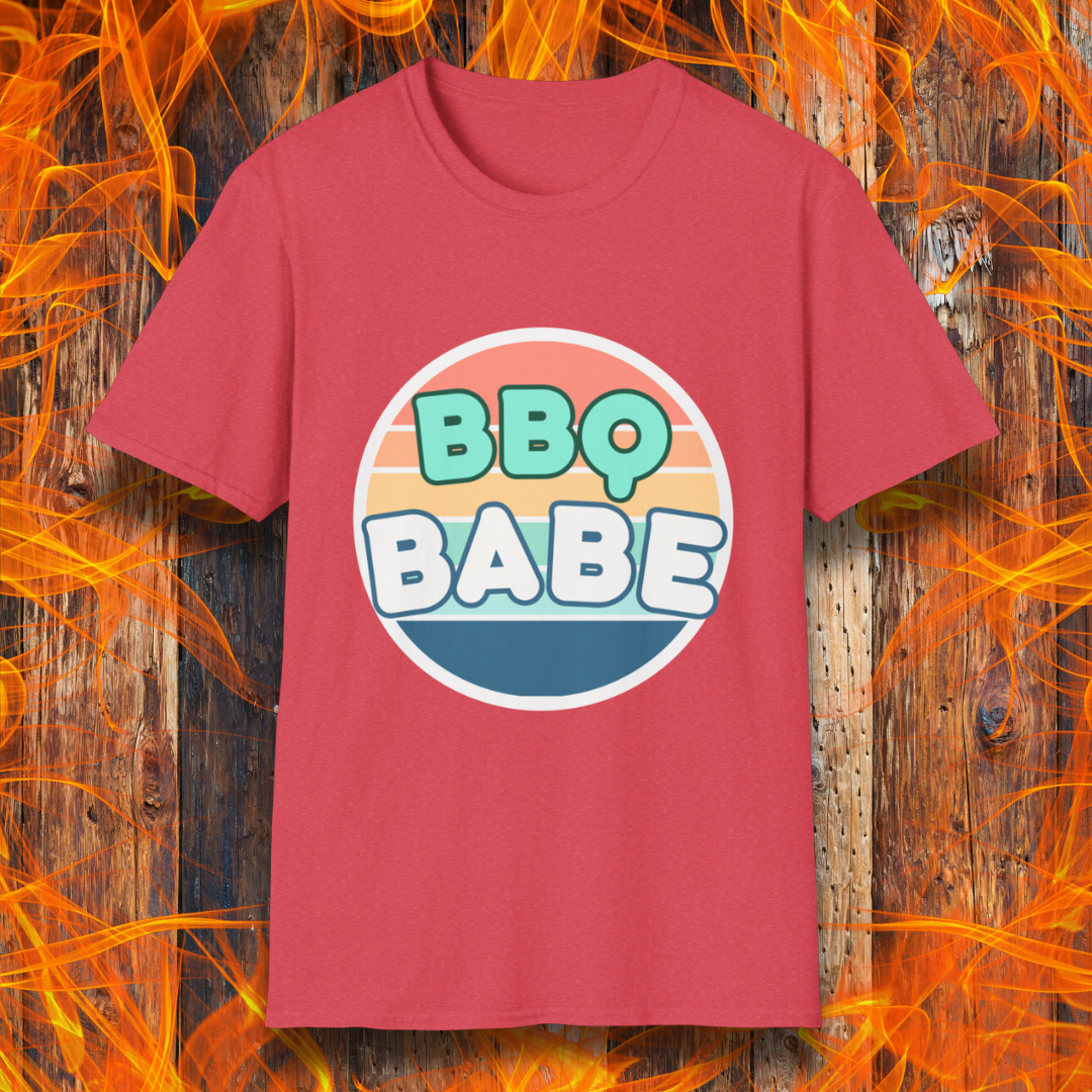 Heather Red T-shirt with a retro-style 'BBQ Babe' design featuring bold, pastel lettering inside a vintage sunset circle. A fun and stylish choice for BBQ enthusiasts who love to grill in style.