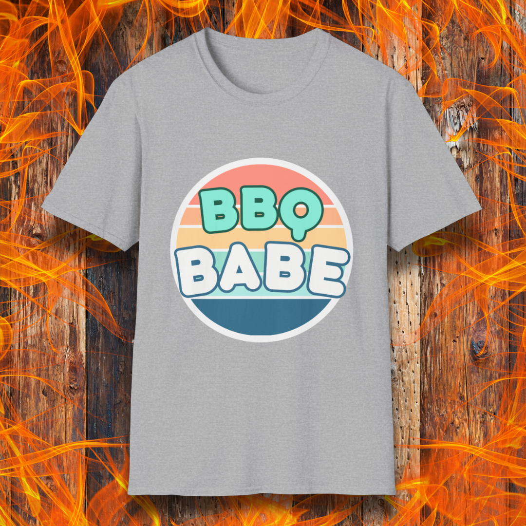 Sport Grey T-shirt with a retro-style 'BBQ Babe' design featuring bold, pastel lettering inside a vintage sunset circle. A fun and stylish choice for BBQ enthusiasts who love to grill in style.