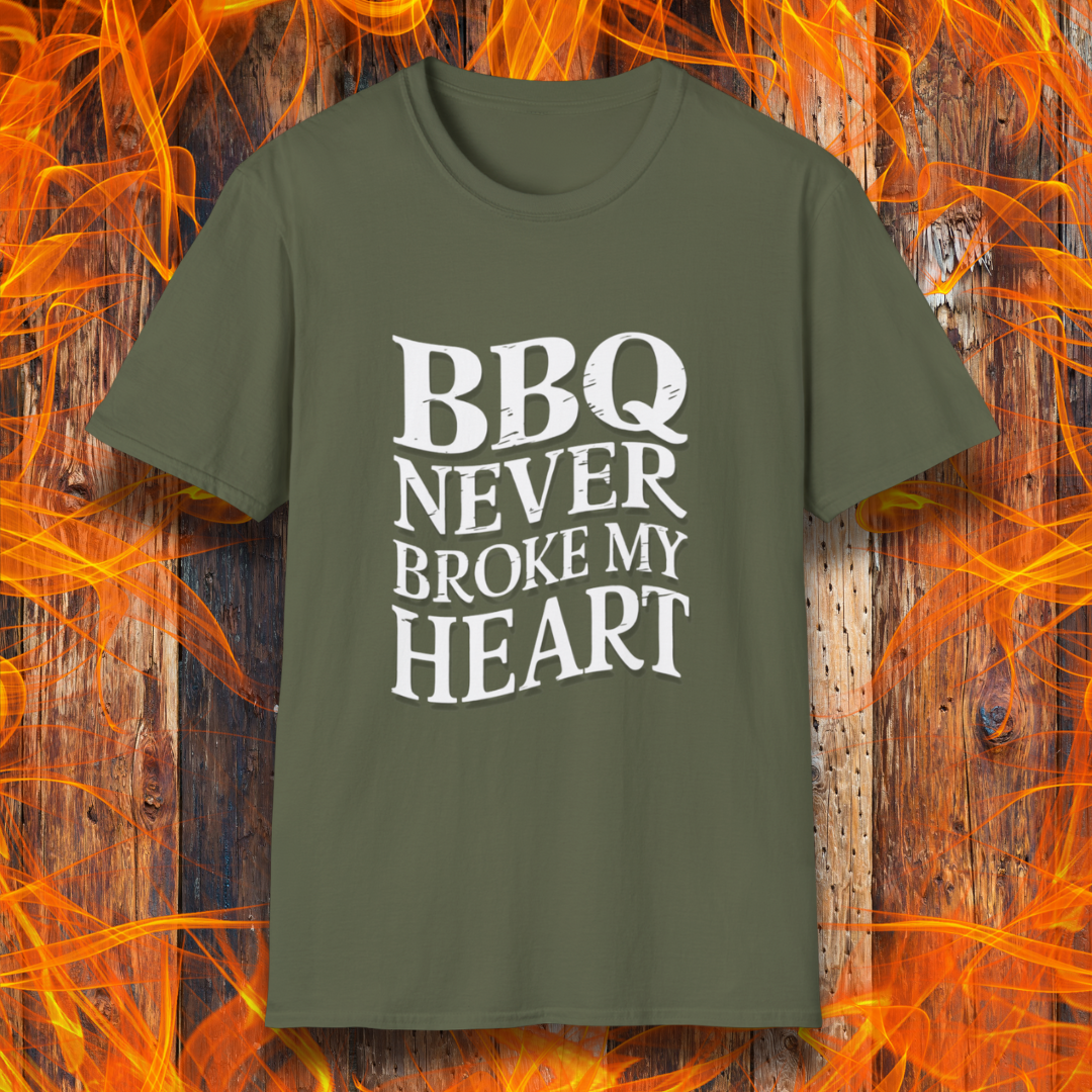 Military Green t-shirt featuring bold white text that reads 'BBQ Never Broke My Heart' in a rustic, slightly distressed font, perfect for barbecue lovers who stay loyal to great smoked meats.