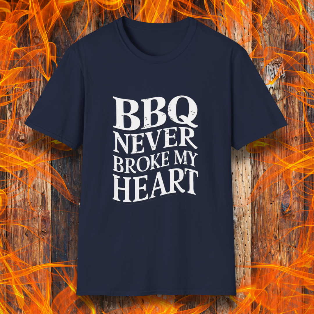 Navy  t-shirt featuring bold white text that reads 'BBQ Never Broke My Heart' in a rustic, slightly distressed font, perfect for barbecue lovers who stay loyal to great smoked meats.