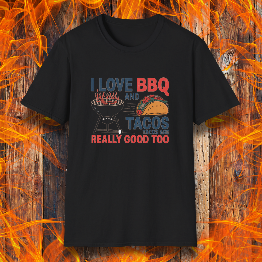 Black T-shirt features a fun and bold design that reads, "I Love BBQ and Tacos... Tacos Are Really Good Too," with graphics of a flaming grill and a delicious taco. Perfect for BBQ lovers who also enjoy a good taco, this shirt combines humor and food passion in a stylish way.