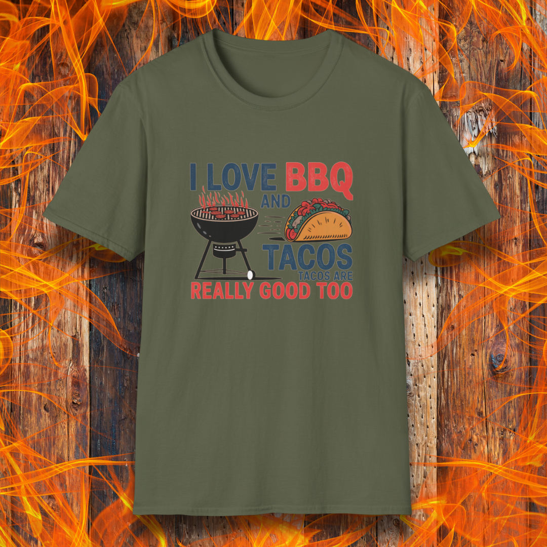Military Green T-shirt features a fun and bold design that reads, "I Love BBQ and Tacos... Tacos Are Really Good Too," with graphics of a flaming grill and a delicious taco. Perfect for BBQ lovers who also enjoy a good taco, this shirt combines humor and food passion in a stylish way.