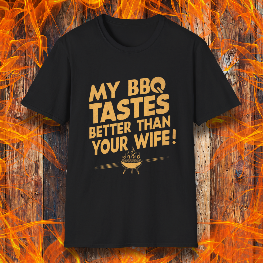 Black T-shirt with a bold, cheeky design that reads 'MY BBQ TASTES BETTER THAN YOUR WIFE!' in vintage-style typography, featuring a small flaming grill icon. Perfect for grill masters with a sense of humor.
