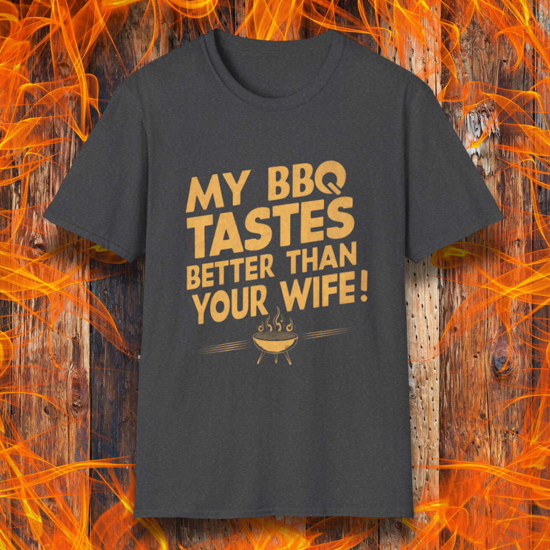 Dark Heather T-shirt with a bold, cheeky design that reads 'MY BBQ TASTES BETTER THAN YOUR WIFE!' in vintage-style typography, featuring a small flaming grill icon. Perfect for grill masters with a sense of humor.
