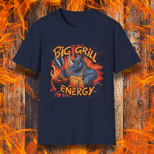 Navy t-shirt featuring a bold and vibrant design of a muscular rhino wearing sunglasses and an apron, grilling meat with tongs in hand. The fiery background highlights the phrase 'Big Grill Energy' in dynamic, flame-inspired lettering