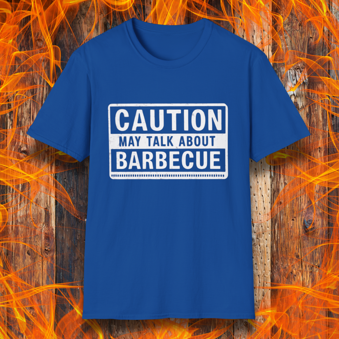 Royal Blue T-shirt featuring a bold, high-contrast design resembling a caution sign. The text reads 'CAUTION MAY TALK ABOUT BARBECUE' in white, with a distressed effect, making it perfect for BBQ enthusiasts who love to chat about grilling.