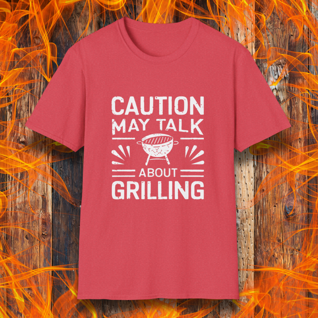 Heather Red T-shirt featuring bold white text that reads 'CAUTION MAY TALK ABOUT GRILLING,' with a vintage-style BBQ grill illustration and decorative lines. Perfect for passionate grill masters who can't stop talking about barbecue.