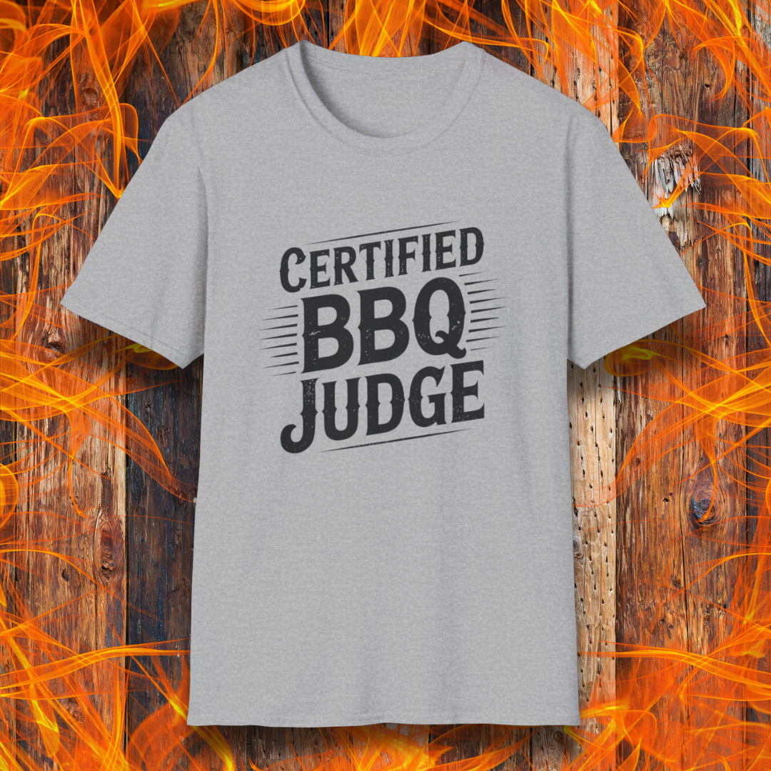 Bold "Certified BBQ Judge" graphic in distressed black text on a sport grey t-shirt, perfect for BBQ-themed apparel or promotional use.