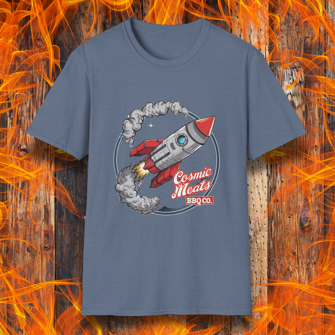 Heather Indigo t-shirt featuring a retro-style rocket blasting off with smoke trails, paired with the text 'Cosmic Meats BBQ Co.'—a fun BBQ-themed space design.