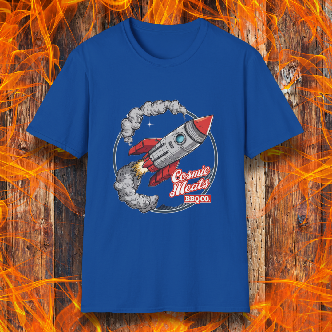 Royal Bluet-shirt featuring a retro-style rocket blasting off with smoke trails, paired with the text 'Cosmic Meats BBQ Co.'—a fun BBQ-themed space design.