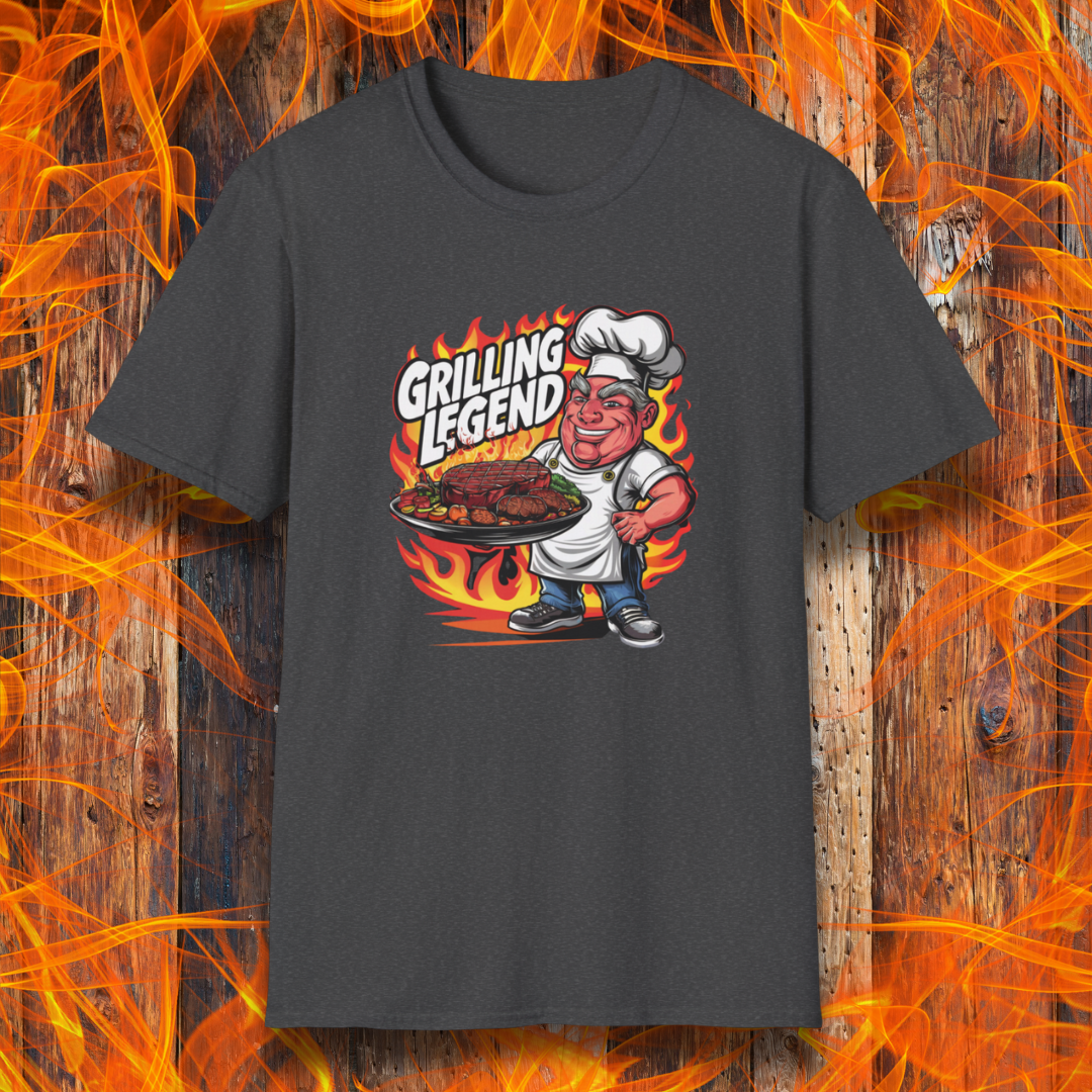 Dark Heather t-shirt featuring a cartoon-style chef character holding a platter of perfectly grilled meats, with flames in the background and bold text that reads 'Grilling Legend'—ideal for BBQ masters and pit bosses