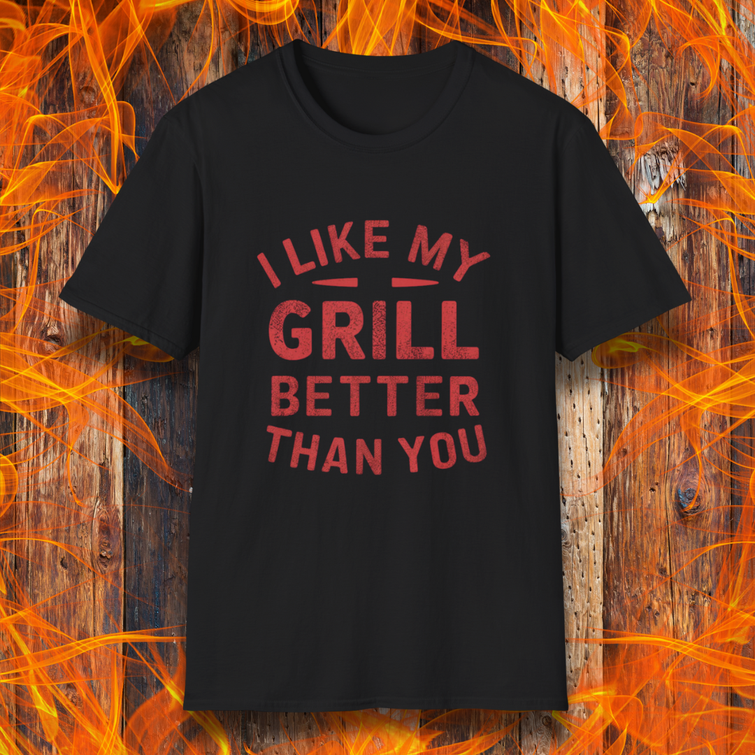 Black T-shirt with a bold and humorous BBQ-themed design. The red distressed-style text reads 'I Like My Grill Better Than You' in an arched layout, perfect for grill masters who take their barbecue seriously. A fun and stylish shirt for BBQ enthusiasts."