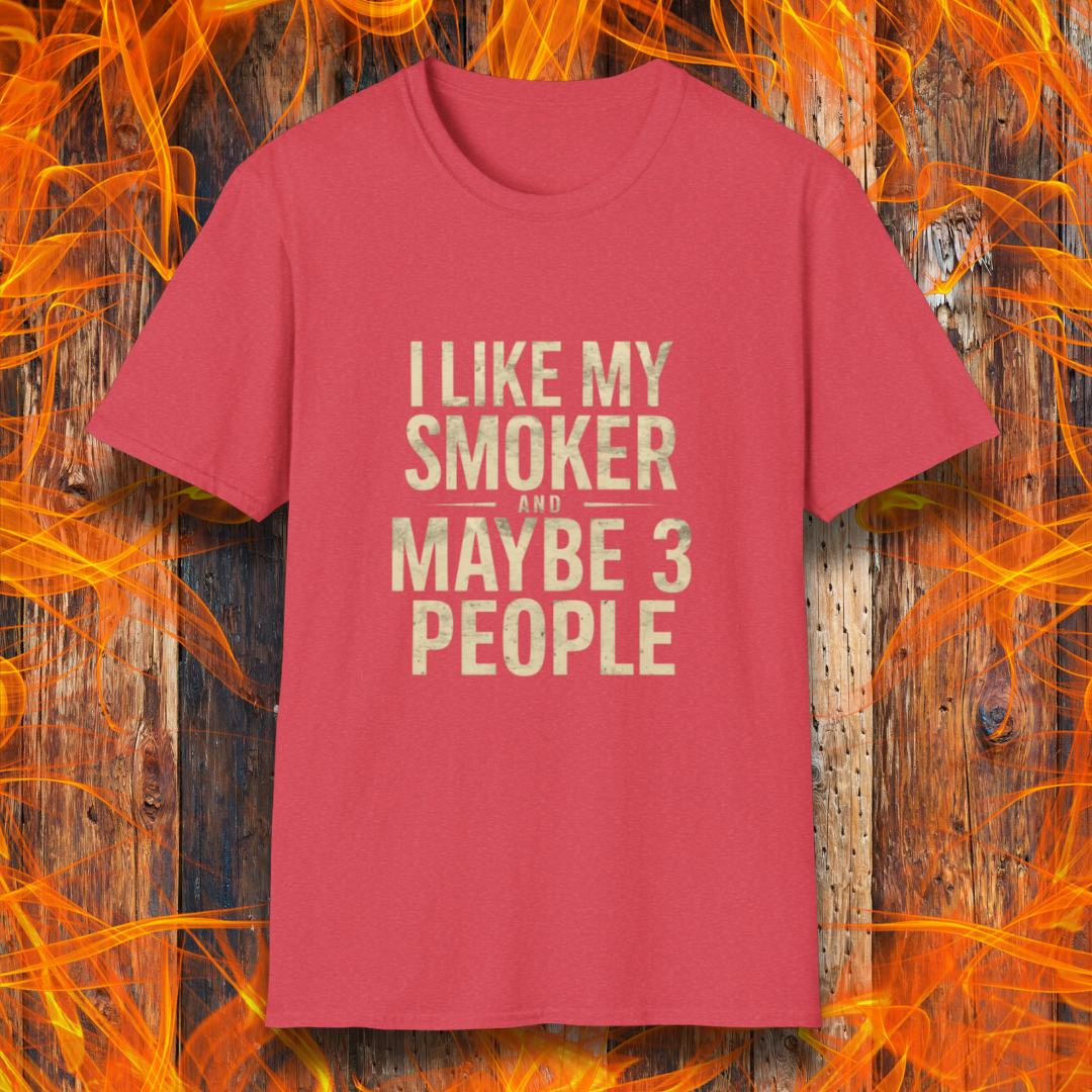 Heather Red T-shirt featuring bold, distressed beige text that reads, 'I Like My Smoker And Maybe 3 People.' A humorous BBQ-themed shirt perfect for pitmasters and grilling enthusiasts who prefer the company of their smoker over most people!