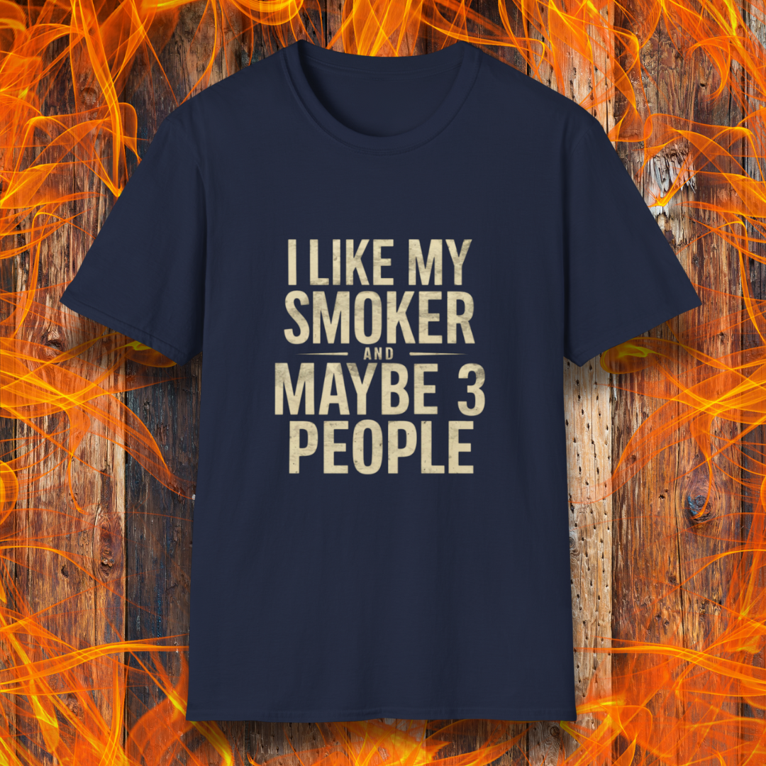 Navy T-shirt featuring bold, distressed beige text that reads, 'I Like My Smoker And Maybe 3 People.' A humorous BBQ-themed shirt perfect for pitmasters and grilling enthusiasts who prefer the company of their smoker over most people!