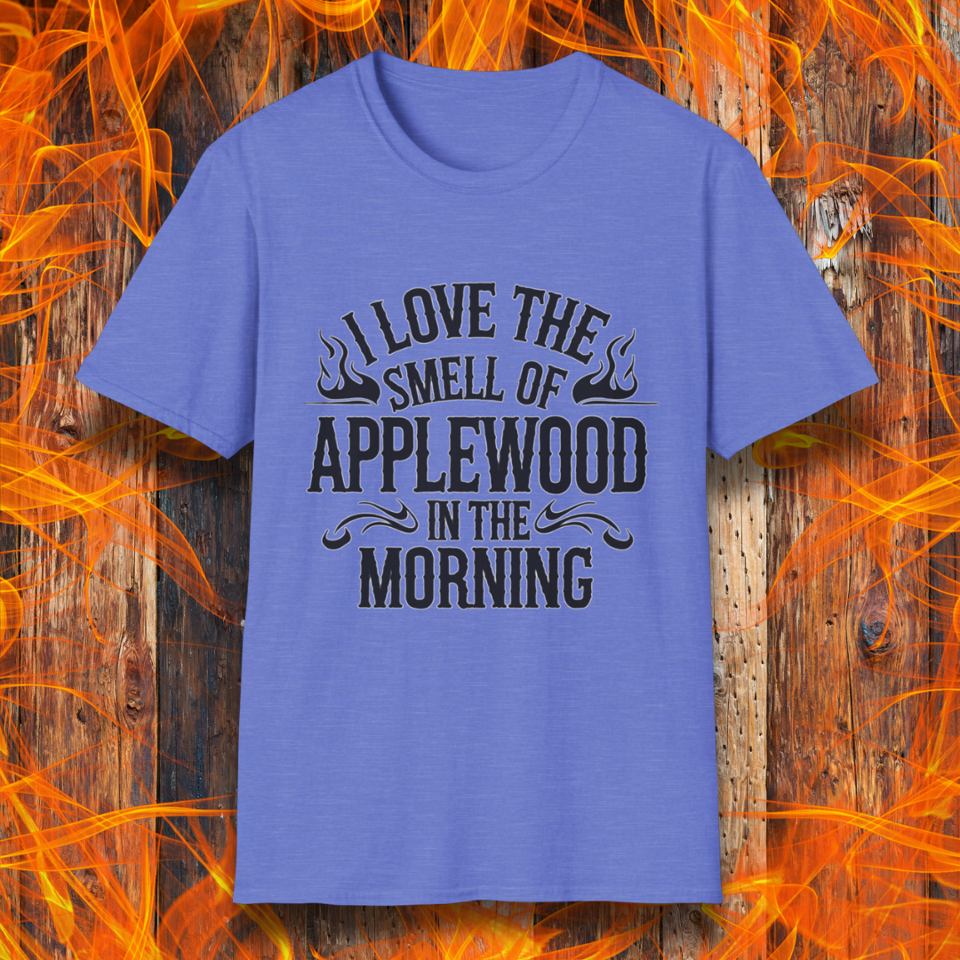 Heather Royal T-shirt featuring bold, rustic-style text that says, "I Love the Smell of Applewood in the Morning," with decorative flames. Perfect for BBQ lovers who appreciate the scent of wood-smoked meats.