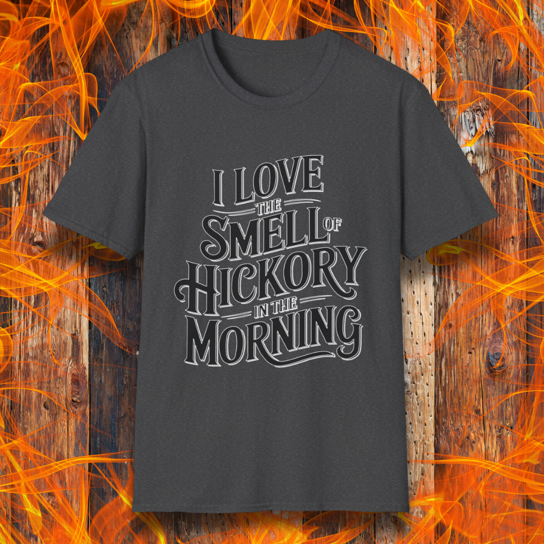 Dark Heather T-shirt featuring bold, vintage-style text that reads, "I Love the Smell of Hickory in the Morning." Perfect for BBQ enthusiasts who enjoy the aroma of smoked meat.