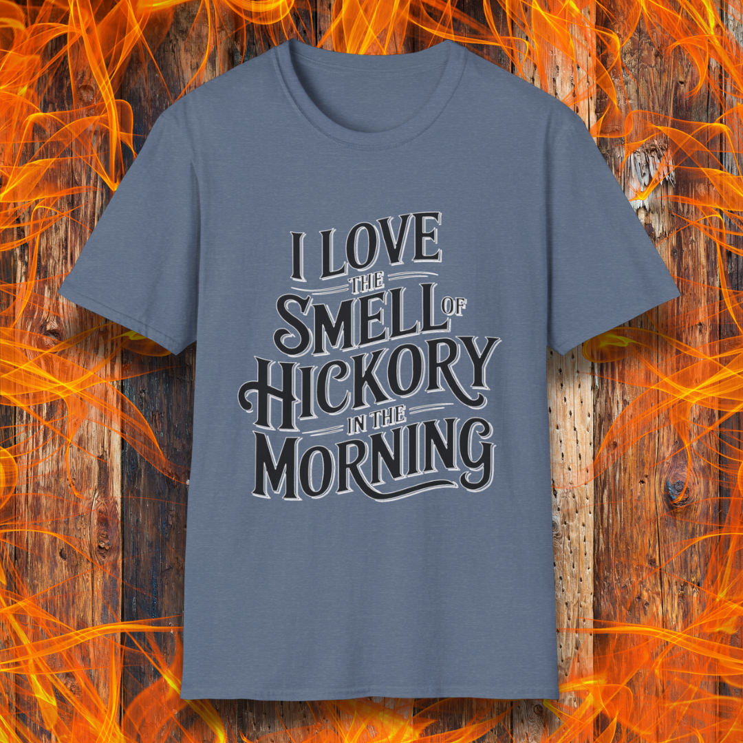 Heather Indigo T-shirt featuring bold, vintage-style text that reads, "I Love the Smell of Hickory in the Morning." Perfect for BBQ enthusiasts who enjoy the aroma of smoked meat.