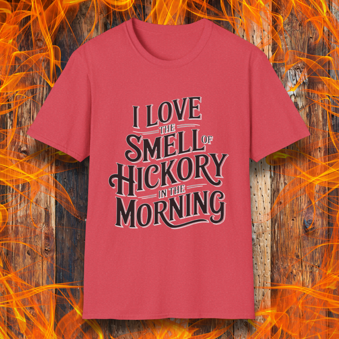 Heather Red T-shirt featuring bold, vintage-style text that reads, "I Love the Smell of Hickory in the Morning." Perfect for BBQ enthusiasts who enjoy the aroma of smoked meat.