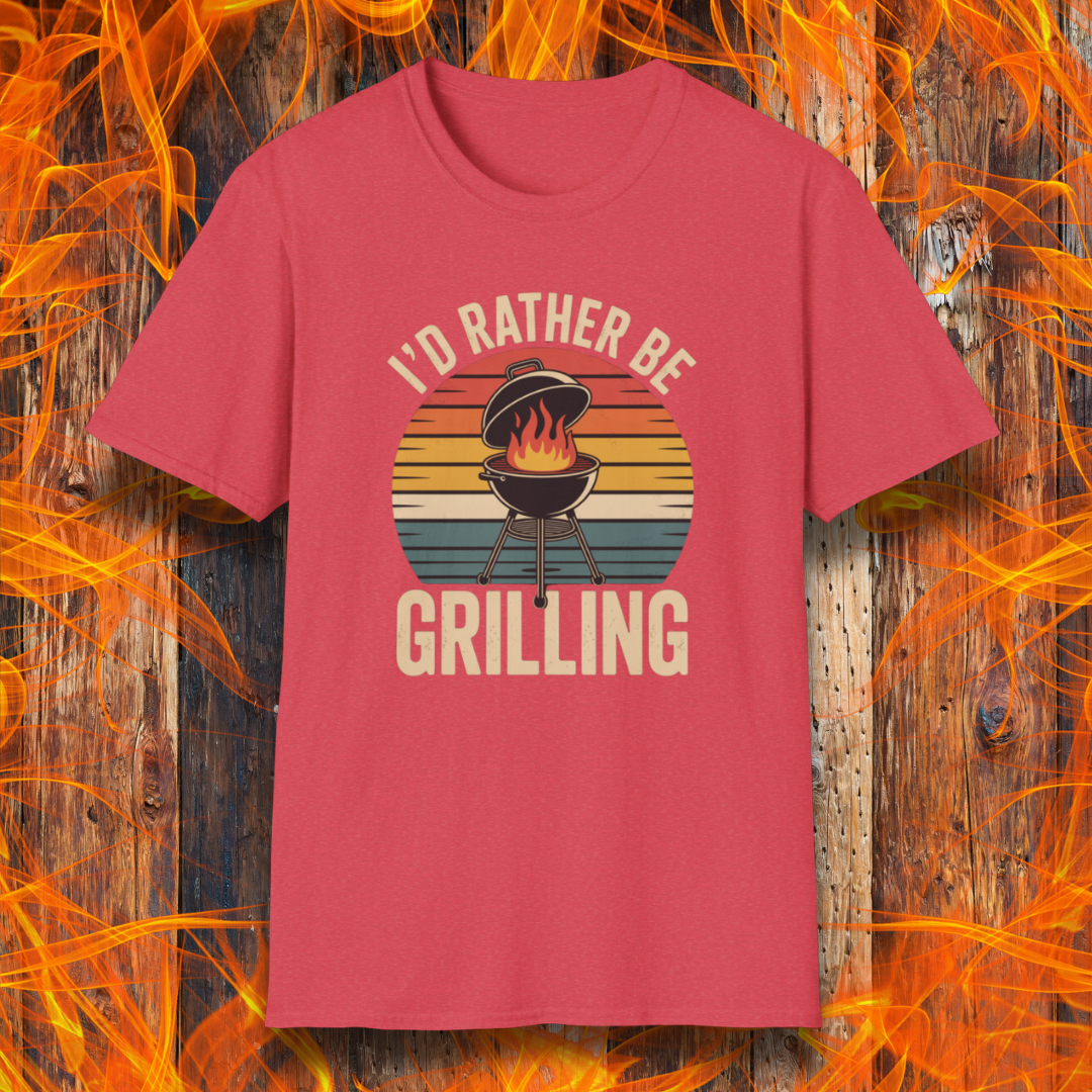 Heather Red t-shirt with 'I'd Rather Be Grilling' graphic on a wooden background with flames.