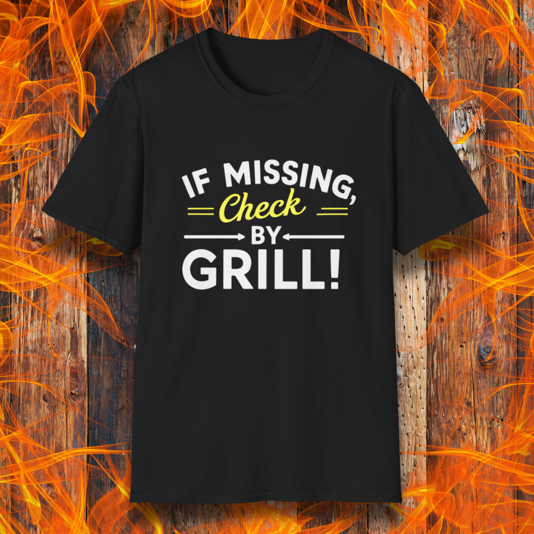 Black T-shirt featuring a fun BBQ-themed design. The bold white and yellow text reads 'IF MISSING, Check BY GRILL!' with decorative arrows and highlights, making it the perfect shirt for grill masters who are always found tending to the flames.