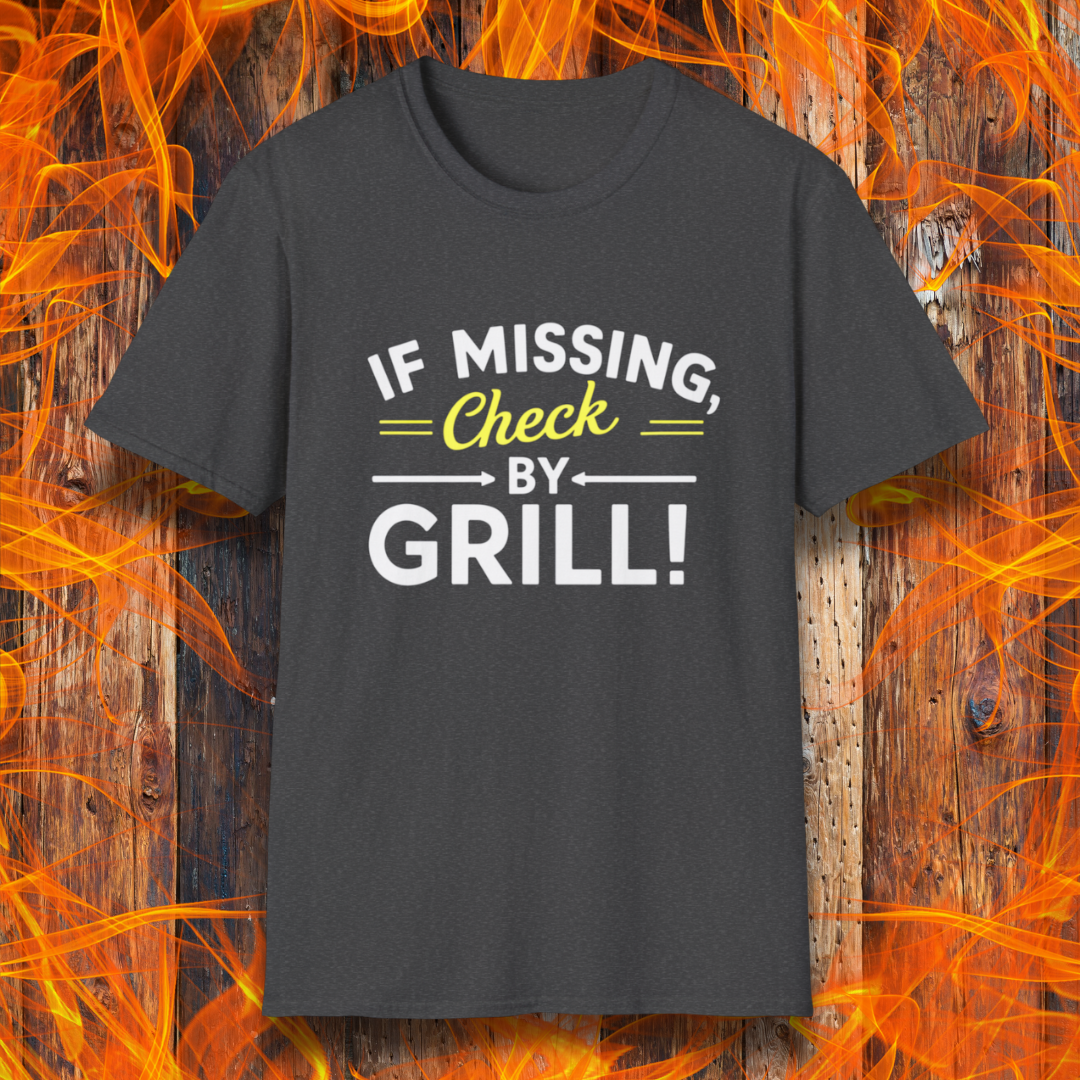 Dark Heather T-shirt featuring a fun BBQ-themed design. The bold white and yellow text reads 'IF MISSING, Check BY GRILL!' with decorative arrows and highlights, making it the perfect shirt for grill masters who are always found tending to the flames.