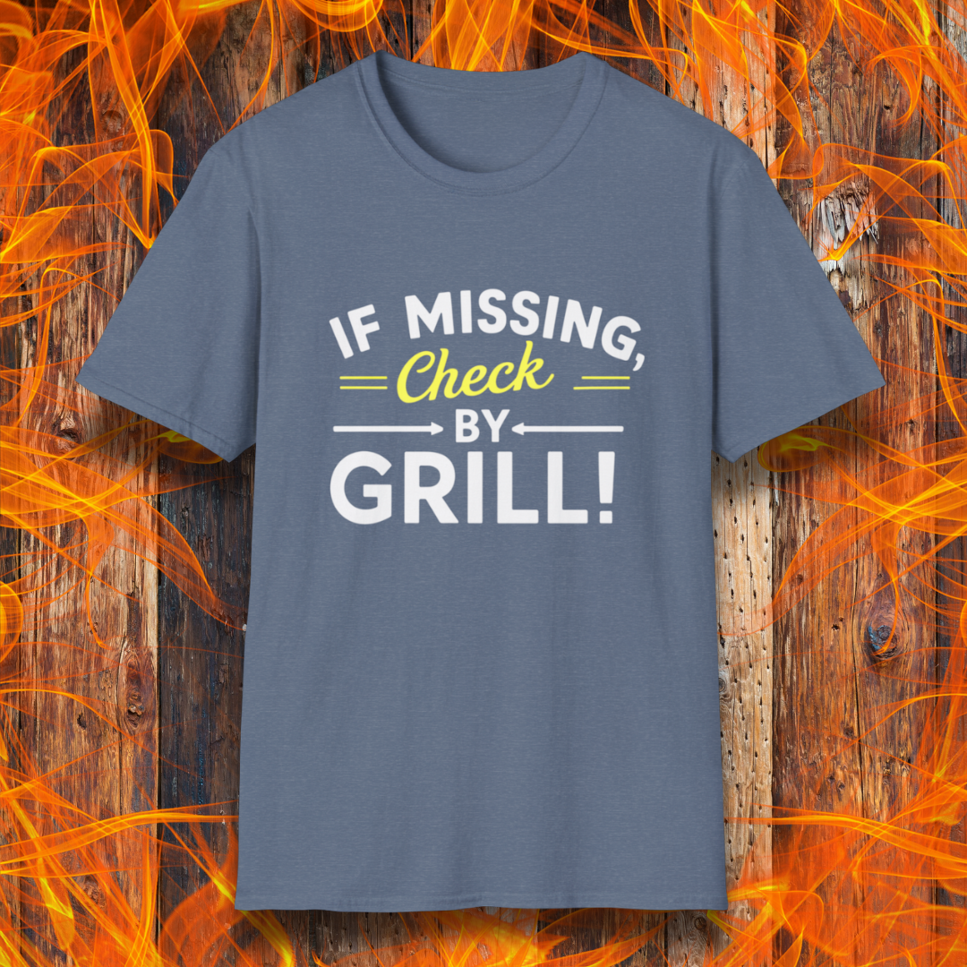 Heather Indigo T-shirt featuring a fun BBQ-themed design. The bold white and yellow text reads 'IF MISSING, Check BY GRILL!' with decorative arrows and highlights, making it the perfect shirt for grill masters who are always found tending to the flames.