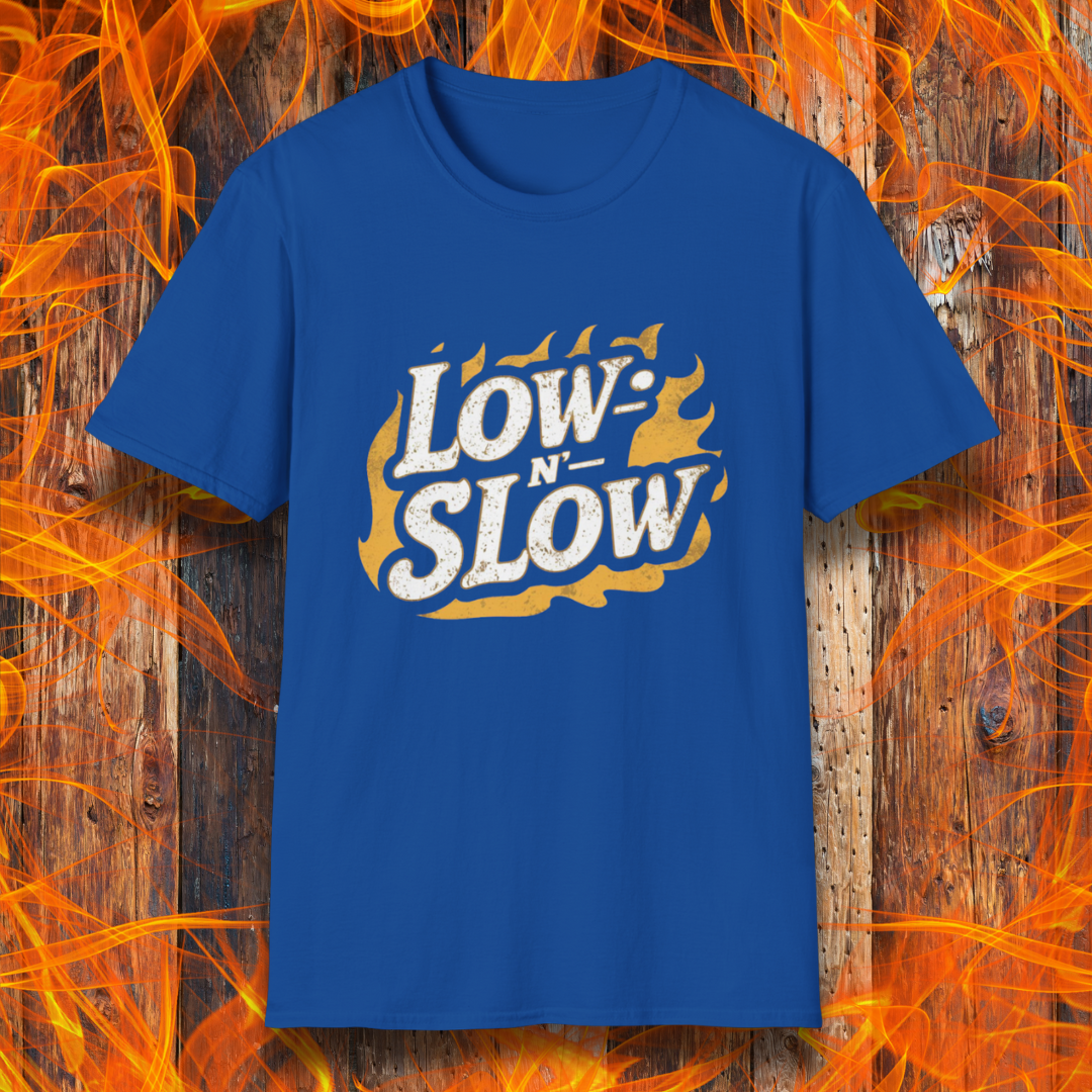 Royal Blue T-shirt featuring 'Low-N-Slow' in bold, distressed lettering over a fiery background. Perfect for BBQ pitmasters who know that great barbecue takes time!