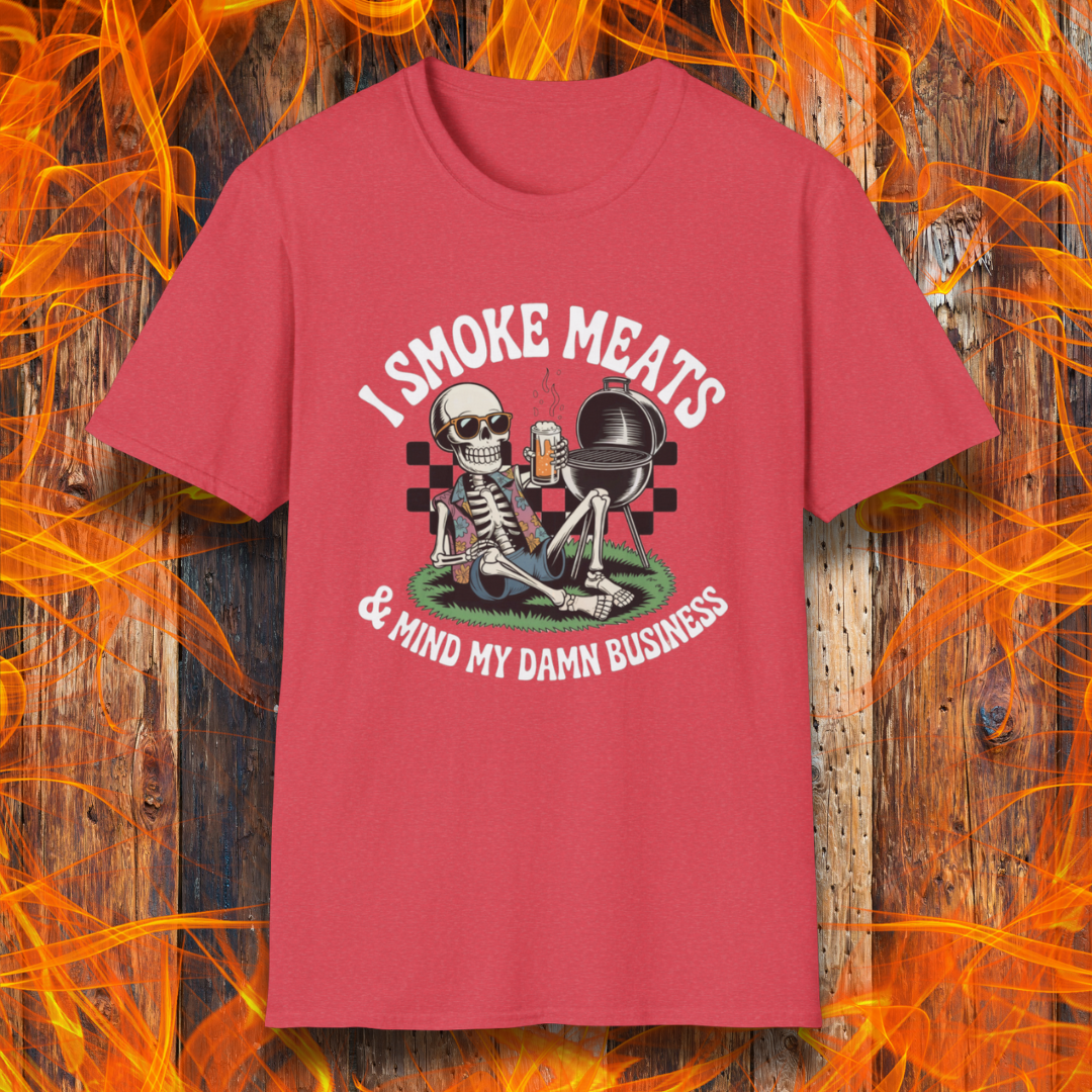 Heather Red t-shirt with a graphic of a skeleton in sunglasses and a Hawaiian shirt holding a beer next to a grill, with the text “I Smoke Meats & Mind My Damn Business.