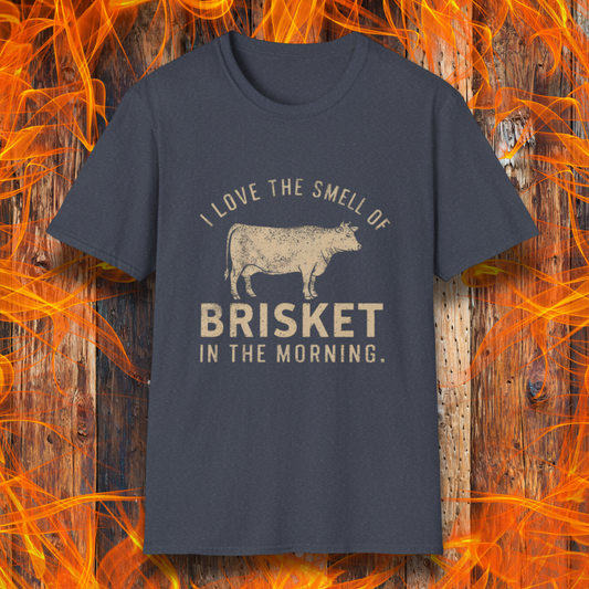 Heather Navy T-shirt featuring vintage-style text that reads 'I Love the Smell of Brisket in the Morning,' along with a rustic, hand-drawn cow illustration. A must-have for BBQ lovers and brisket enthusiasts!