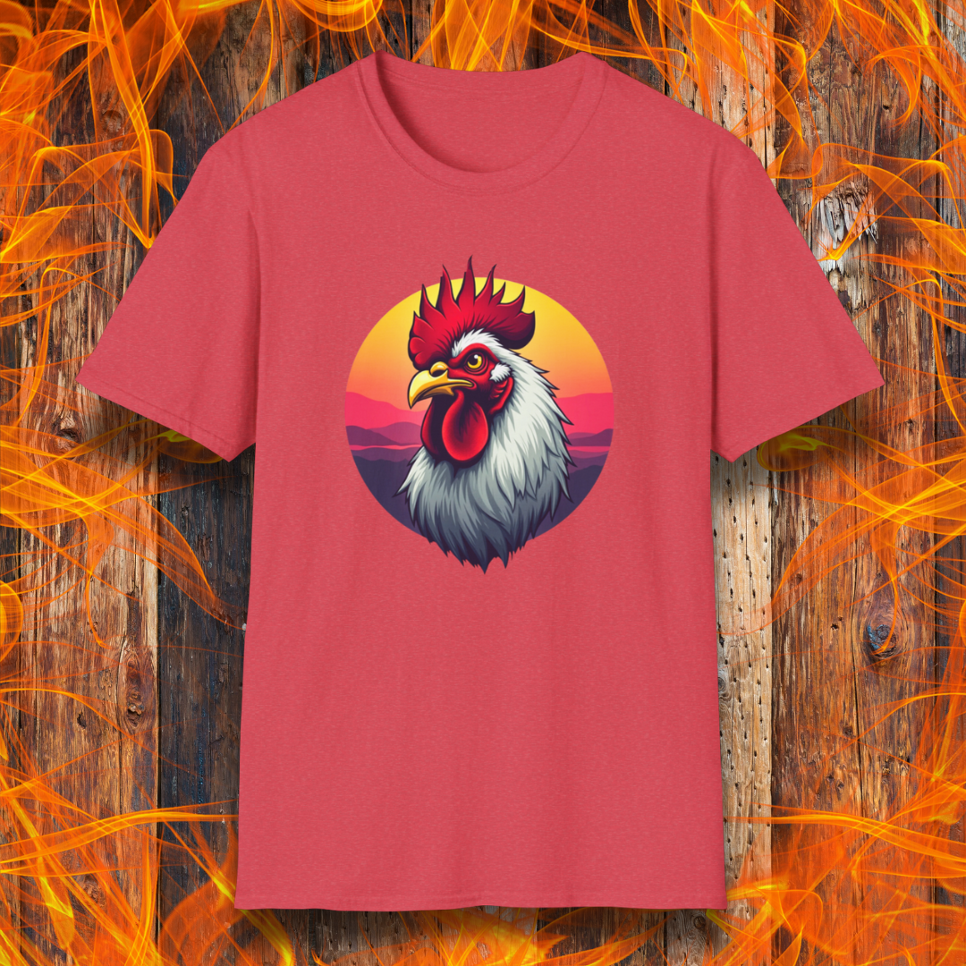 Heather Red T-shirt featuring a bold and colorful illustration of a rooster with a dramatic red comb and white feathers, set against a circular sunset background with warm hues of orange, pink, and purple. The design exudes a rustic and vibrant aesthetic, perfect for BBQ and farm-style enthusiasts.