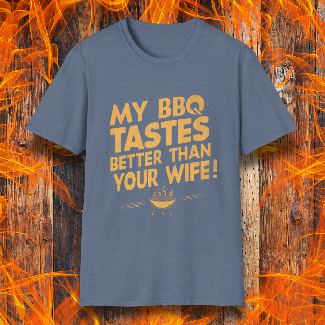 Heather Indigo T-shirt with a bold, cheeky design that reads 'MY BBQ TASTES BETTER THAN YOUR WIFE!' in vintage-style typography, featuring a small flaming grill icon. Perfect for grill masters with a sense of humor.