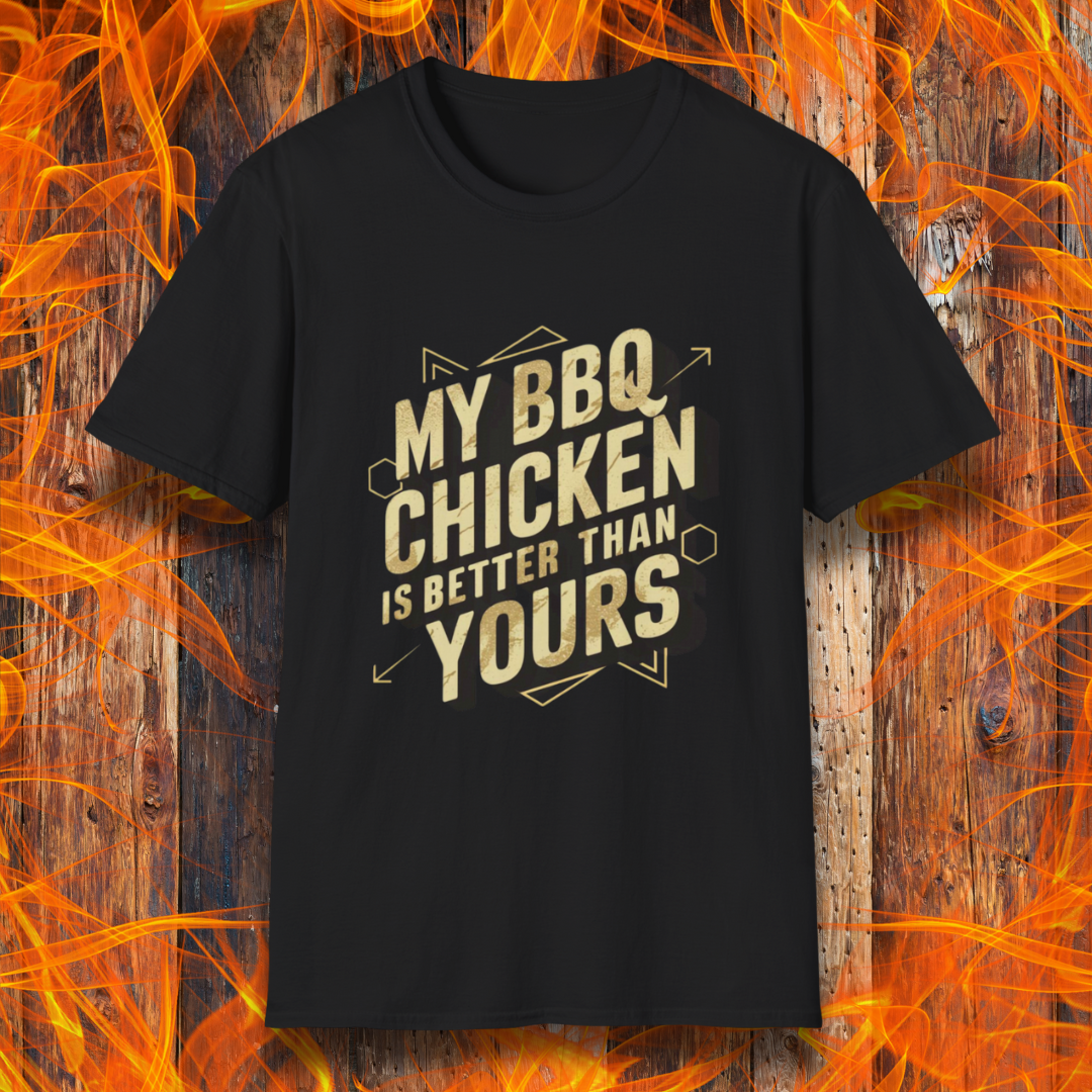 Black T-shirt featuring a bold BBQ-themed design that reads 'MY BBQ CHICKEN IS BETTER THAN YOURS' in gold and black block lettering with geometric accents. A great choice for grill masters who take pride in their perfectly smoked and seasoned chicken.